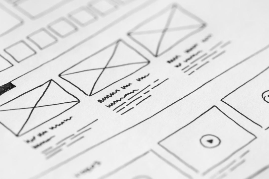 Wireframe sketch on paper of a user interface for a web site.